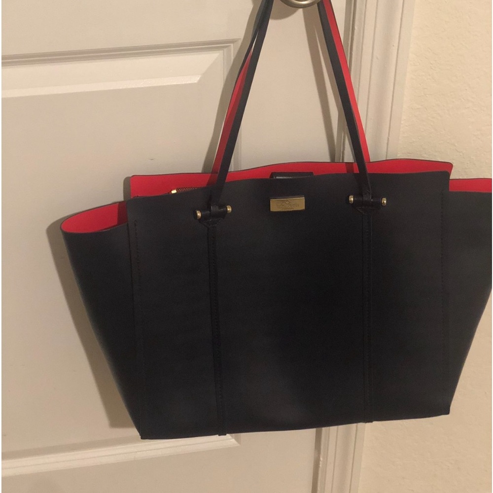 Kate spade navy purse with orange inside Beautiful hand bag great condition